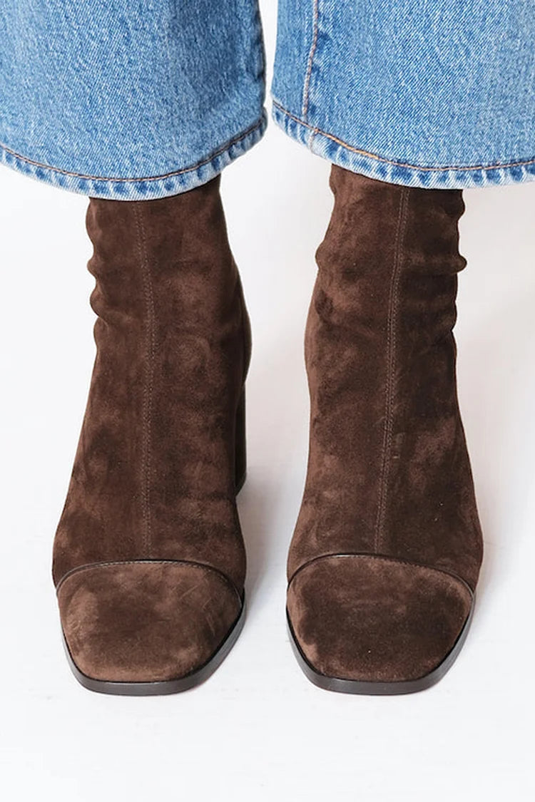 Dark brown suede mid-calf pull-on boots with stitched sides and almond toe