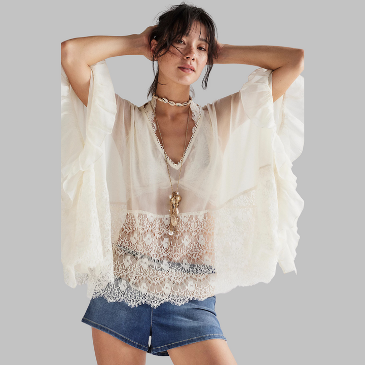 Off-white V-neck batwing cover-up top with lace yoke and ruffle sleeves