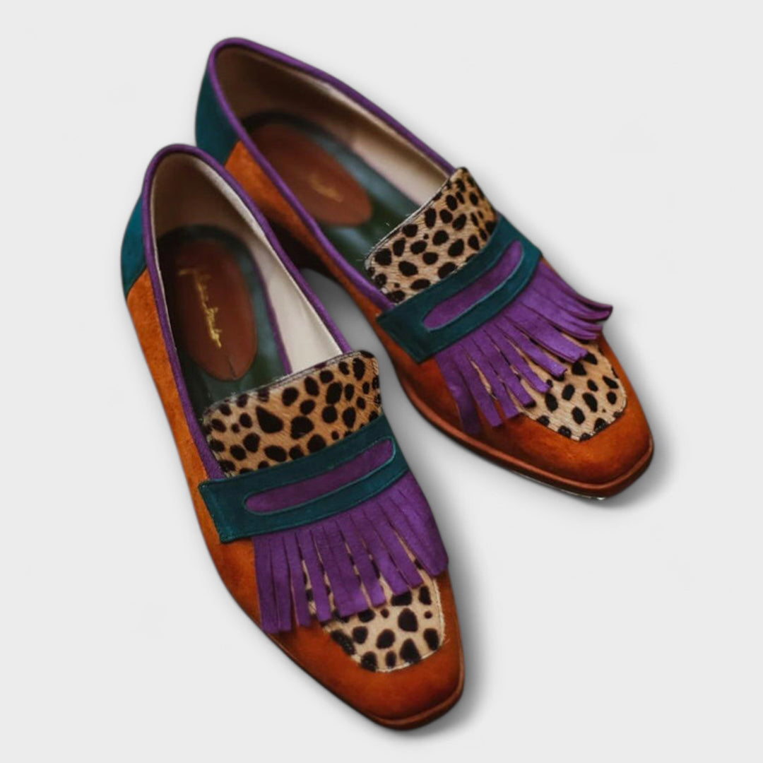 Brown leopard print loafer with purple tassel fringe and teal strap detail