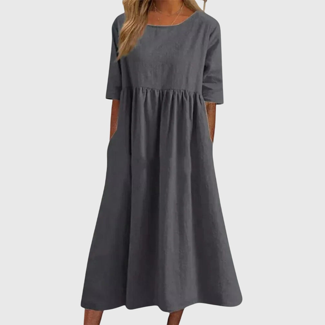 Gray short-sleeve dress with round neck, gathered waist, and full midi skirt