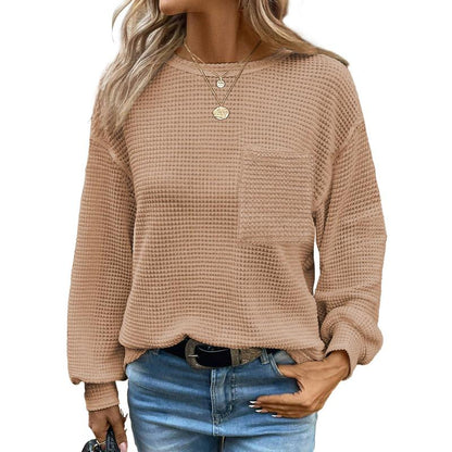 Beige oversized long-sleeve crewneck blouse with waffle knit texture and chest pocket
