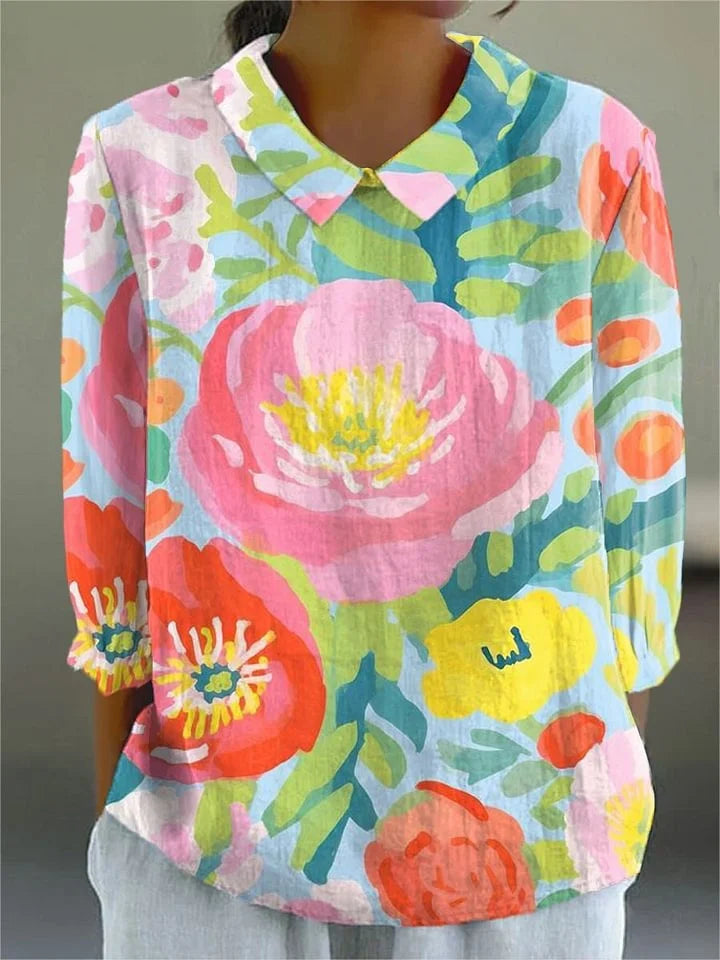 Multicolor floral print blouse with V-neck collar and three-quarter sleeves