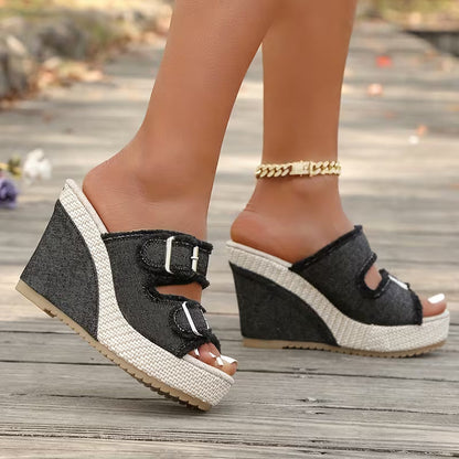 Black wedge sandals with buckle straps and open toe, textured platform sole