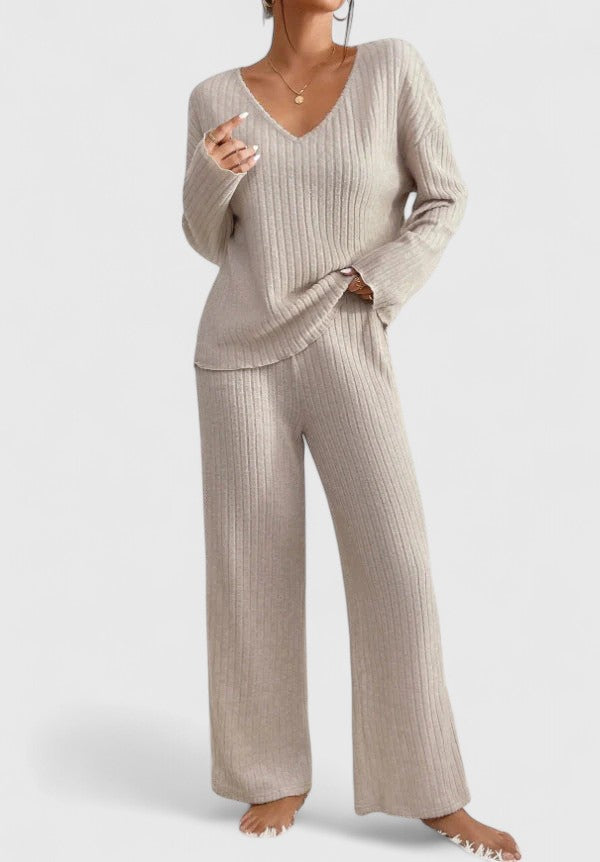 Beige ribbed v-neck sweater and wide-leg pants set, relaxed fit.