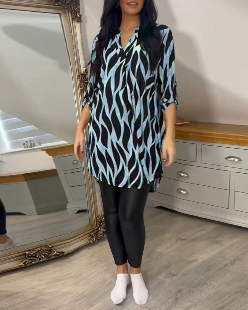 Printed loose-fit top with V-neck and zebra-style abstract pattern, front view