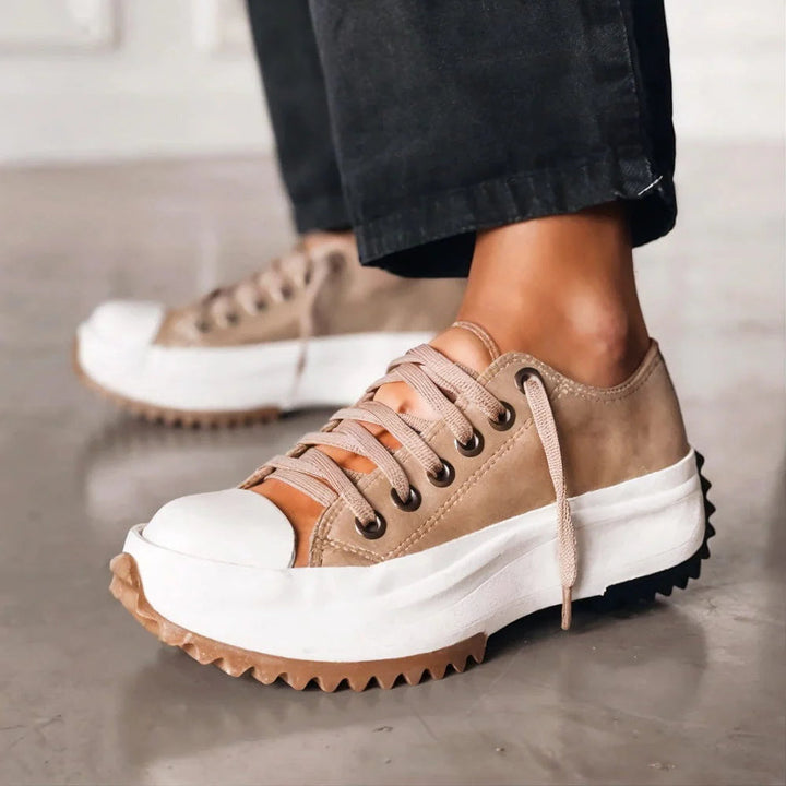 Beige orthopedic sneakers with lace-up front and white cushioned sole