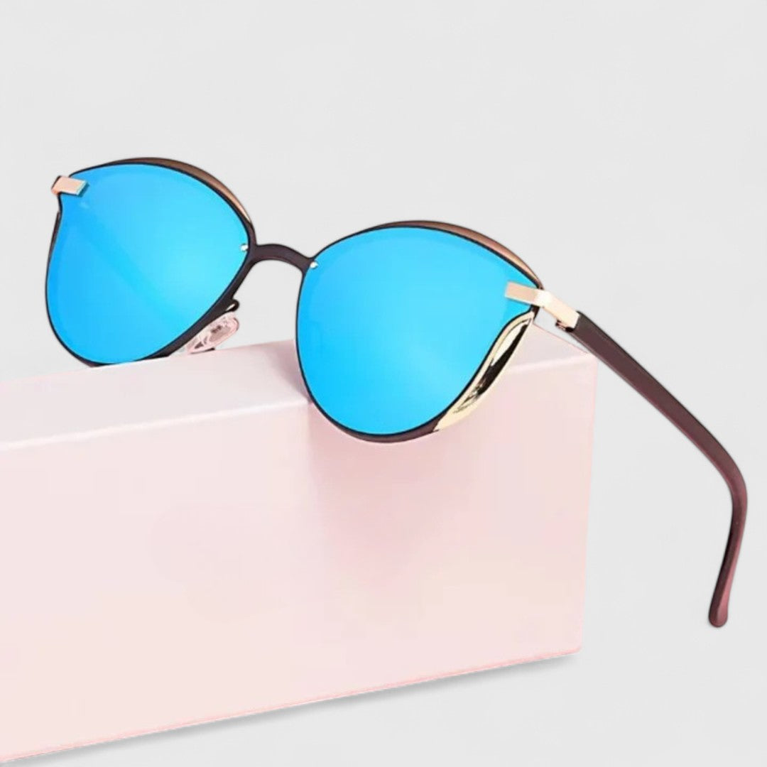 Blue mirrored round sunglasses with gold bar detail and dark brown temple tips