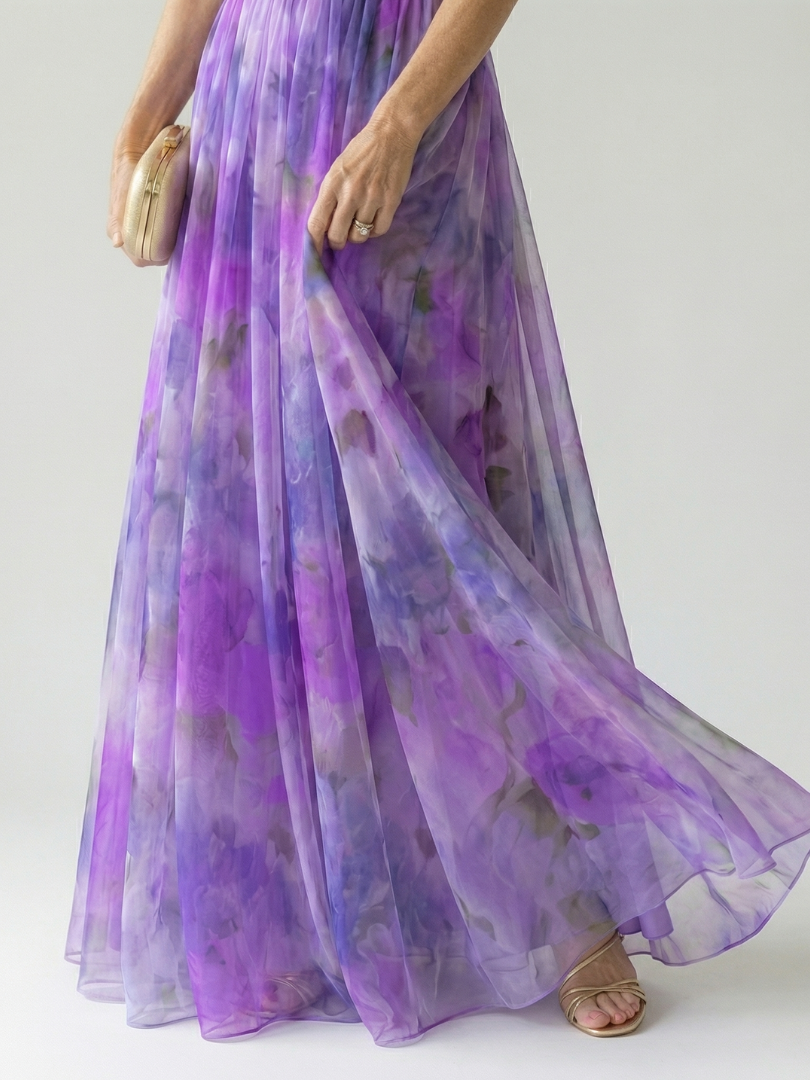 Maxi wrap dress skirt detail, sleeveless V-neck twist-front, purple-toned watercolor print