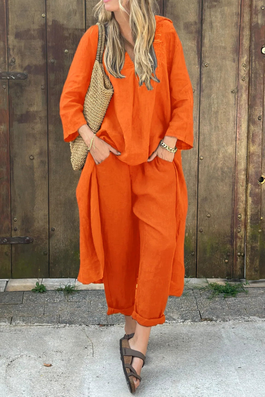 Orange two-piece set with V-neck tunic top and relaxed-fit cropped pants
