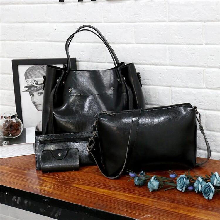 Women’s retro 4-piece bag set in black: structured tote, shoulder bag, crossbody, wallet.
