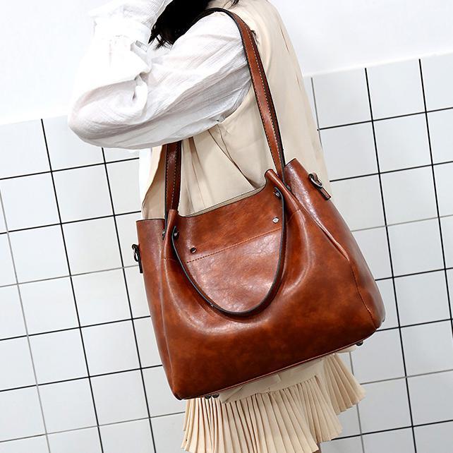 Brown women’s retro tote bag with long strap and matching crossbody wallet, 4-piece set.