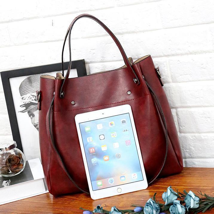 Red tote bag with top handles and front tablet pocket