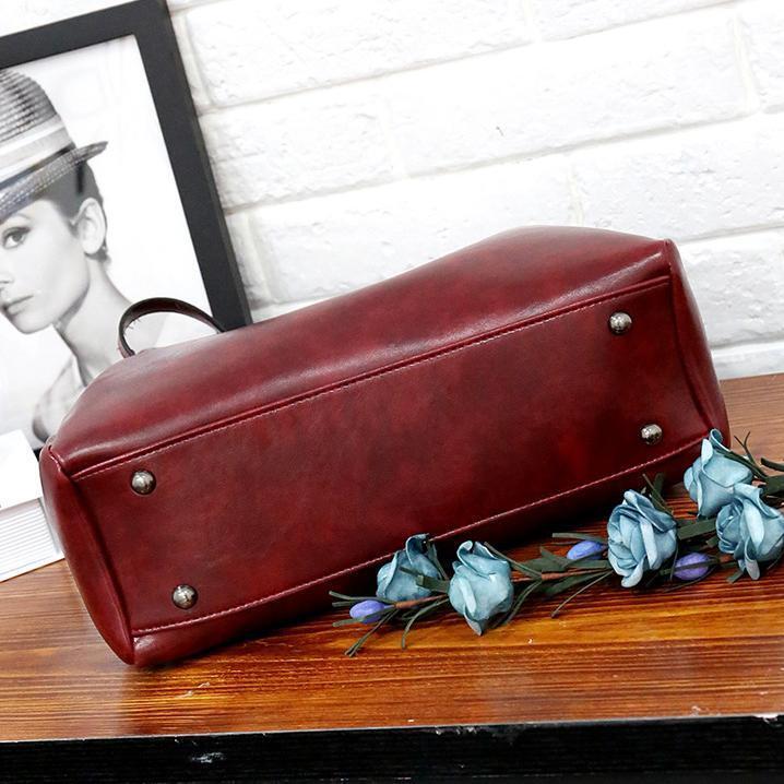 Red tote bag base with metal stud feet and structured bottom