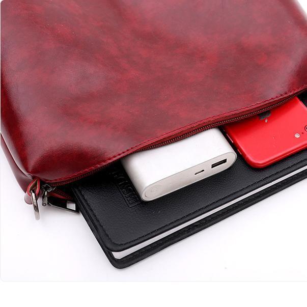 Red bag interior view with zippered pocket and card slots