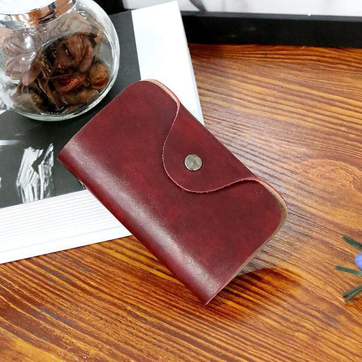 Red leather-look card holder wallet with snap button closure