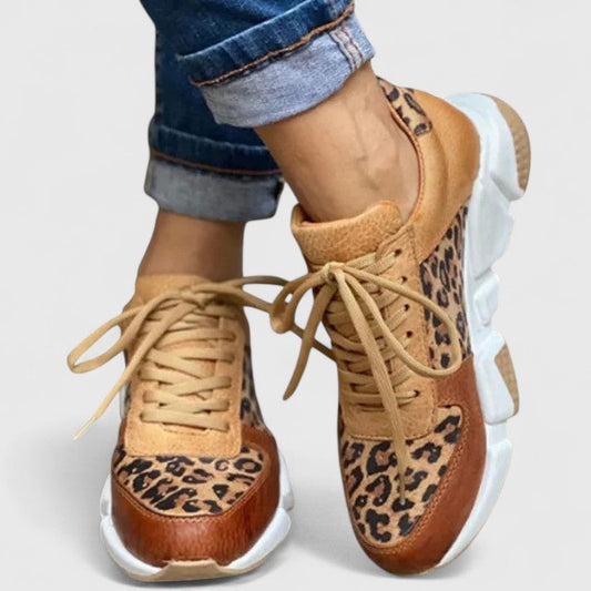 Leopard-print lace-up sneakers with tan laces and white chunky sole