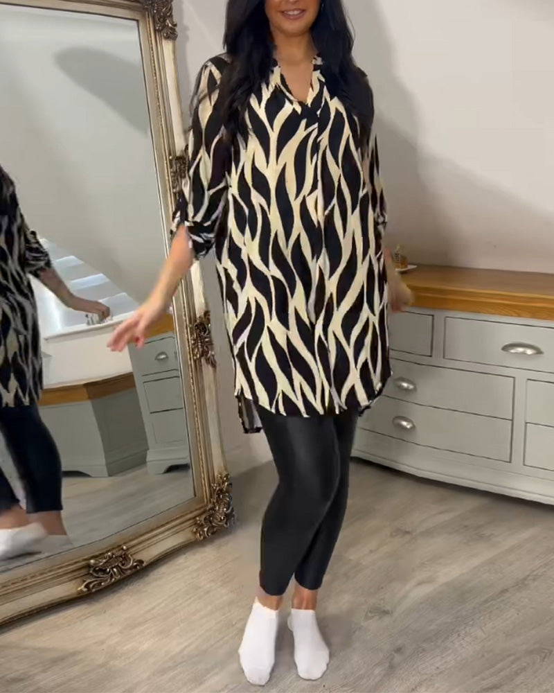 Printed loose-fit top with V-neck and abstract zebra-style pattern, full-length front