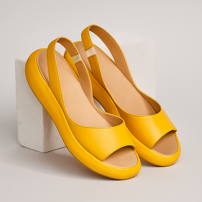 Yellow open-toe wedge sandals with wide front strap and cushioned sole