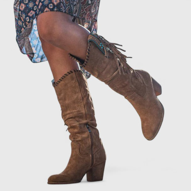 Brown suede block heeled tall boots with fringe tassels and stitched panels