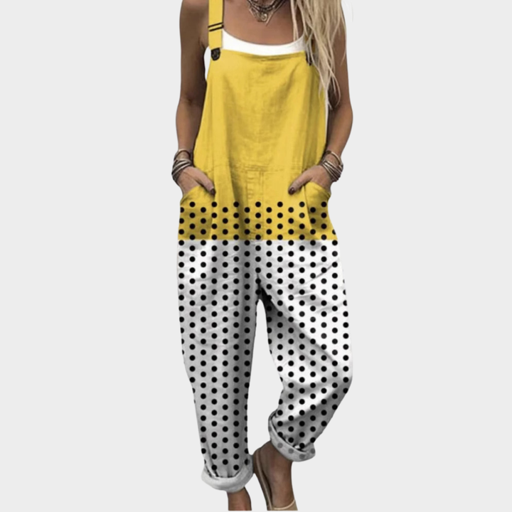 Yellow and black polka dot printed overalls with adjustable straps and loose legs
