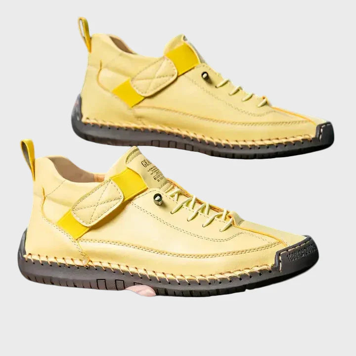 Orthopedic sneakers in yellow with lace-up front, ankle strap, and stitched rubber outsole