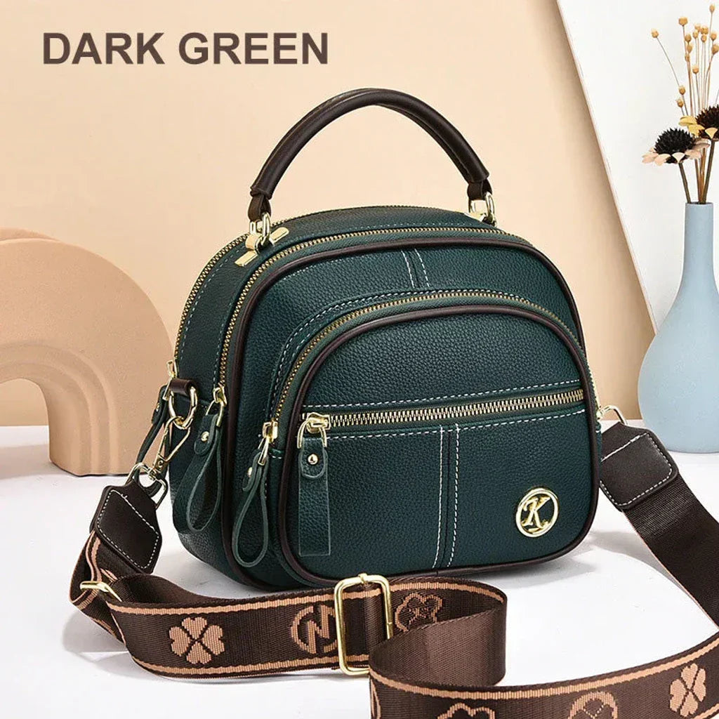 Mini chic crossbody shoulder bag in dark green with gold-tone hardware and zip compartments