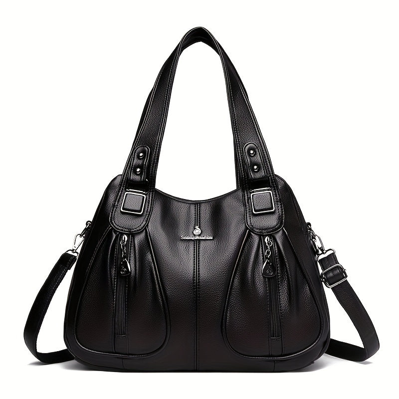 Women’s casual shoulder bag in black with top handles and adjustable shoulder strap.