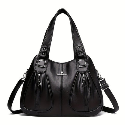 Women’s casual shoulder bag in black with top handles and adjustable shoulder strap.