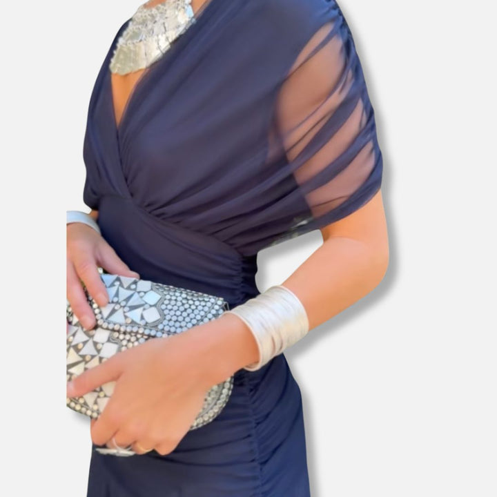 Elegant dress in navy with V-neckline and draped shoulder detail