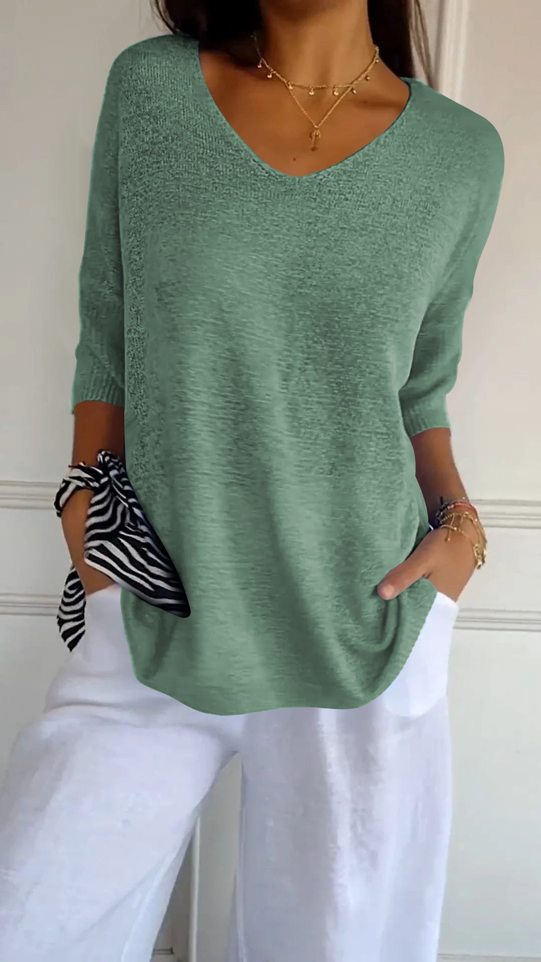 Women’s casual V-neck knit top in green, 3/4 sleeves with relaxed silhouette