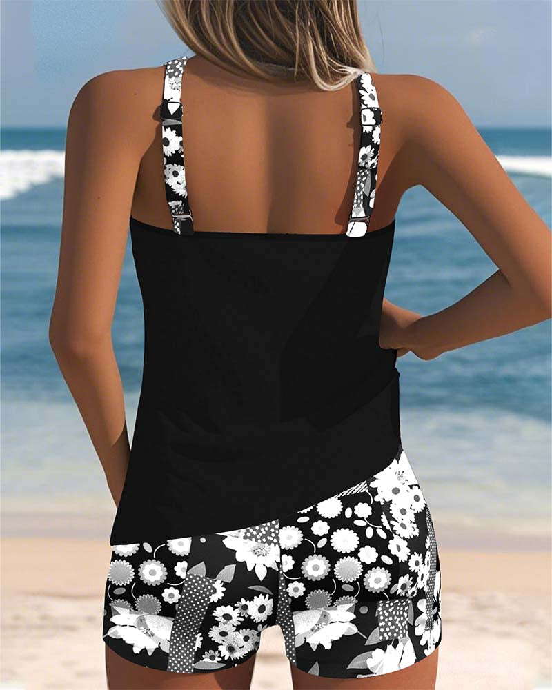 Black swimsuit tank and printed boxer shorts set with white floral sleeves and straps