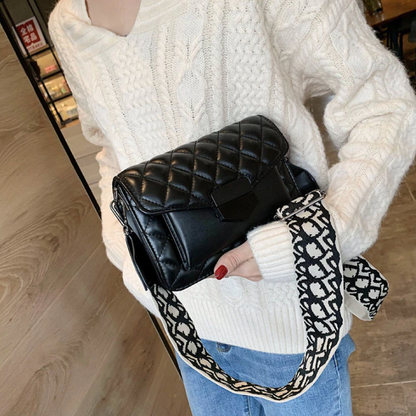 Black quilted leather shoulder handbag with chain strap and patterned trim