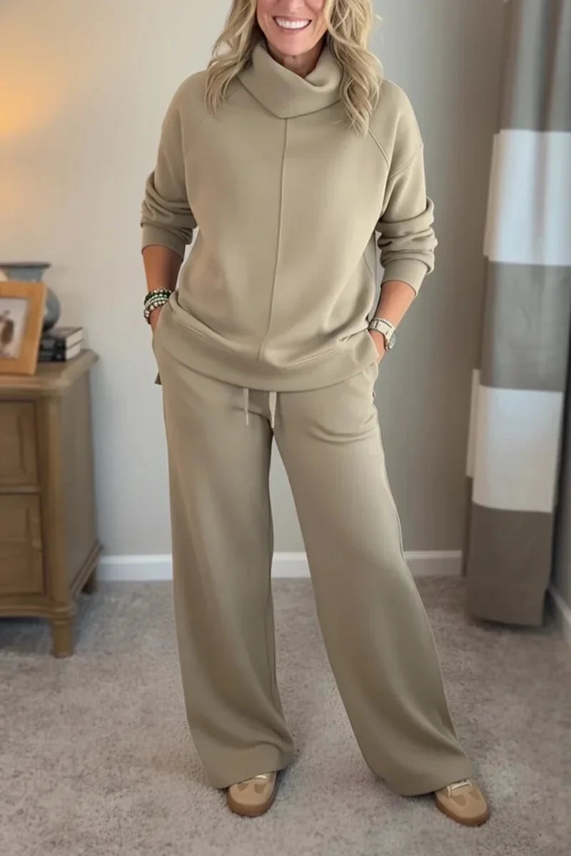 Beige coordinated zip-front hoodie top and wide-leg pants set.
