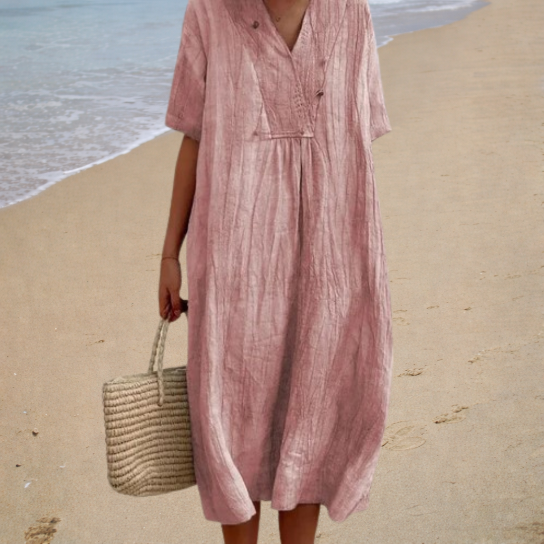 Dusty pink summer dress with V-neck, short sleeves, button front, and gathered waist