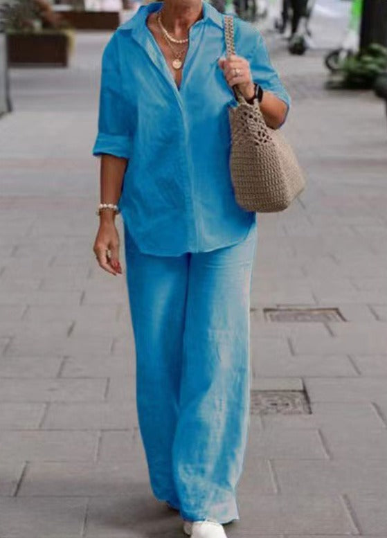 Light blue two-piece set: button-up top with wide-leg trousers.