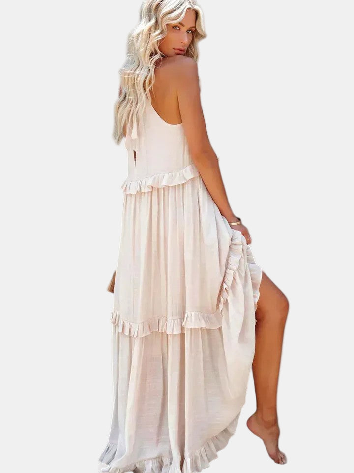 White tiered long dress with sleeveless halter top and layered ruffle skirt