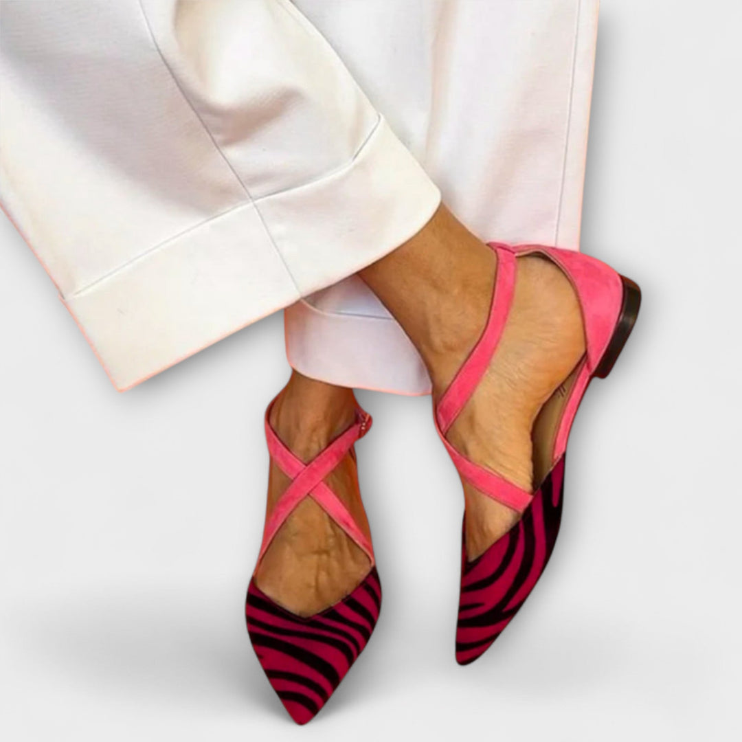 Pink band loafers with magenta zebra-print pointed toe, cross straps, low black heel