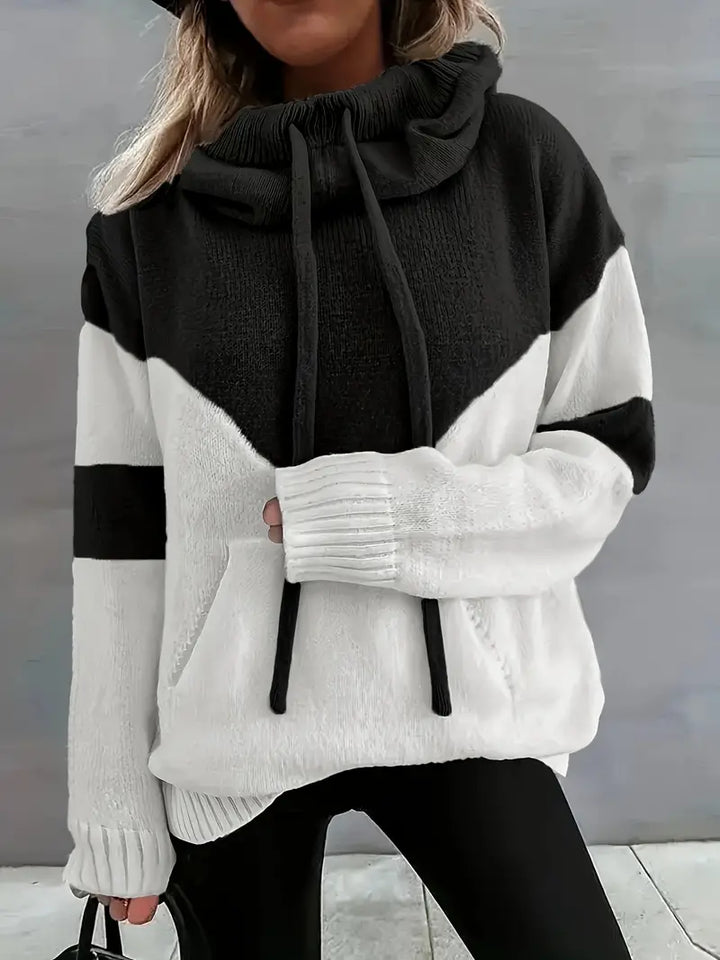 Black and white dual-tone hooded hoodie with drawstring and front pocket