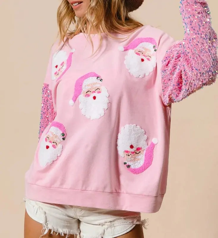 Pink Christmas pullover with sequin sleeve cuffs and multiple white snowman appliques