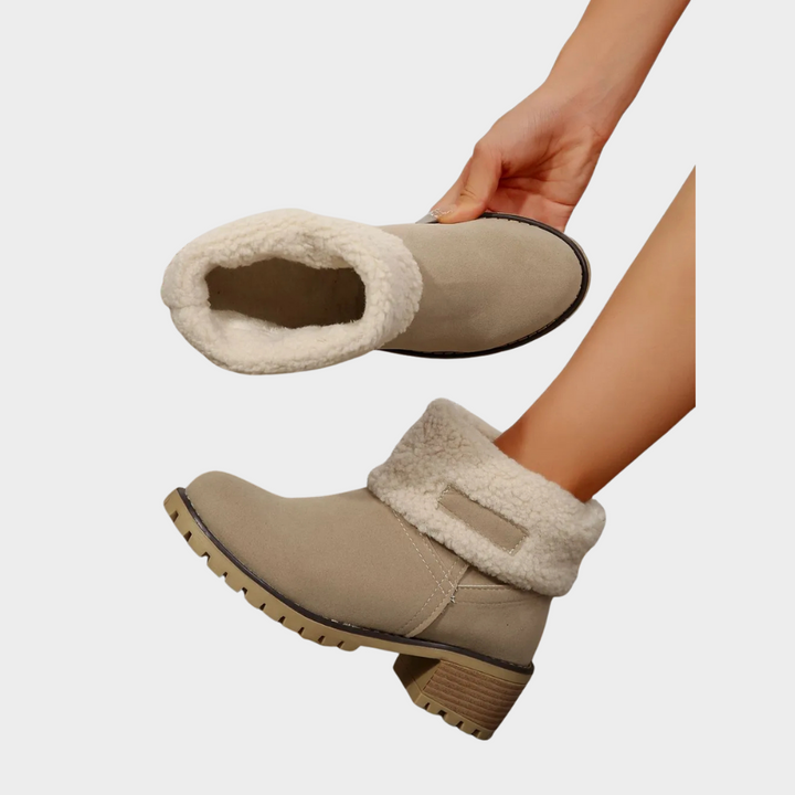 Tan suede winter boots with white sherpa cuff, showing open top and cushioned lining