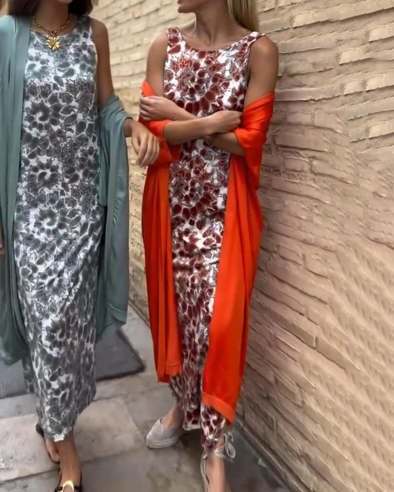Red two-piece set: sleeveless patterned maxi dress with lightweight orange-red outer layer