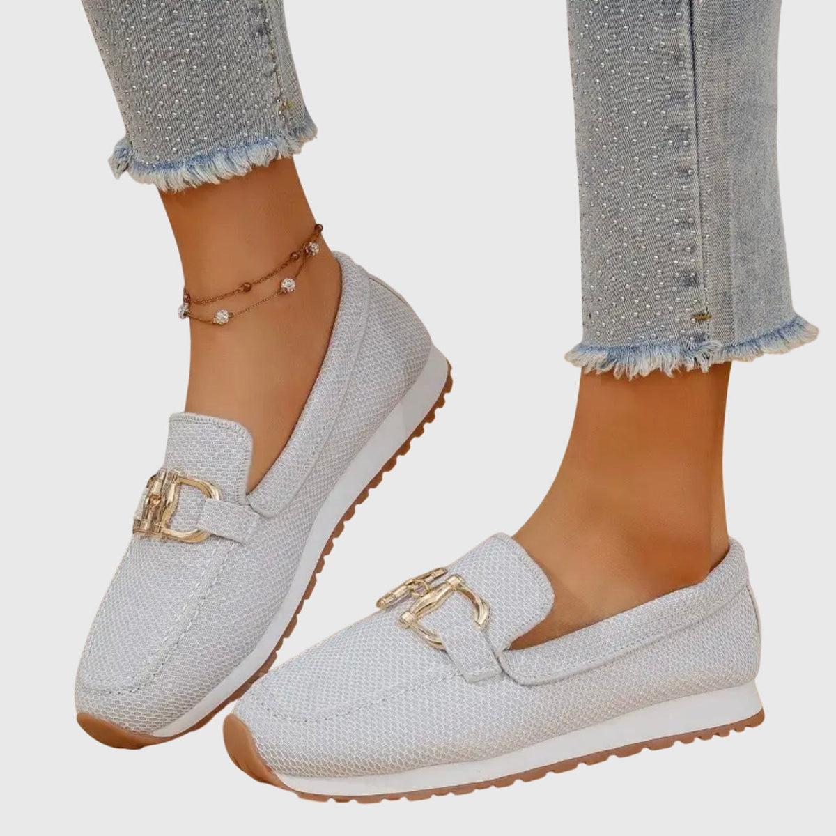 White textured loafer sneakers with gold-toned buckle detail