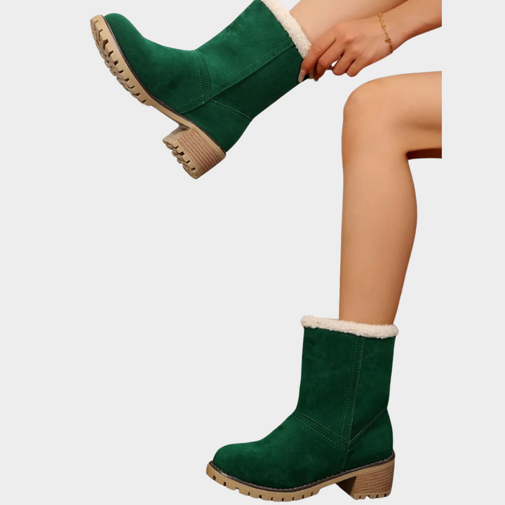 Green suede mid-heel winter boots with sherpa cuffs and lug sole