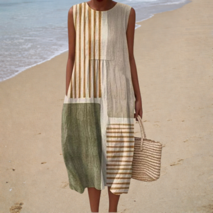 Sleeveless summer dress with vertical stripes and color-block panels, knee length.