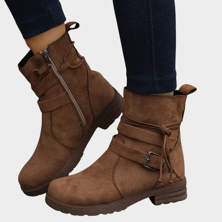 Brown low-heel ankle boots with side zipper, pull tab, and ankle lace tie
