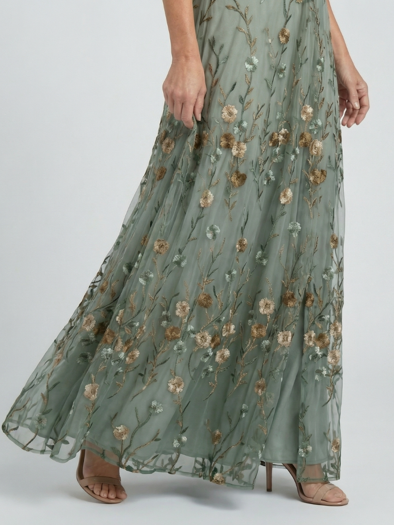 Sage green floral maxi dress with gathered tiered skirt and sheer look