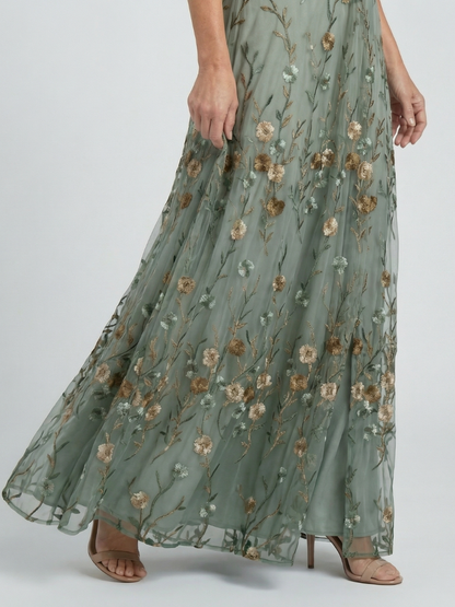 Sage green floral maxi dress with gathered tiered skirt and sheer look