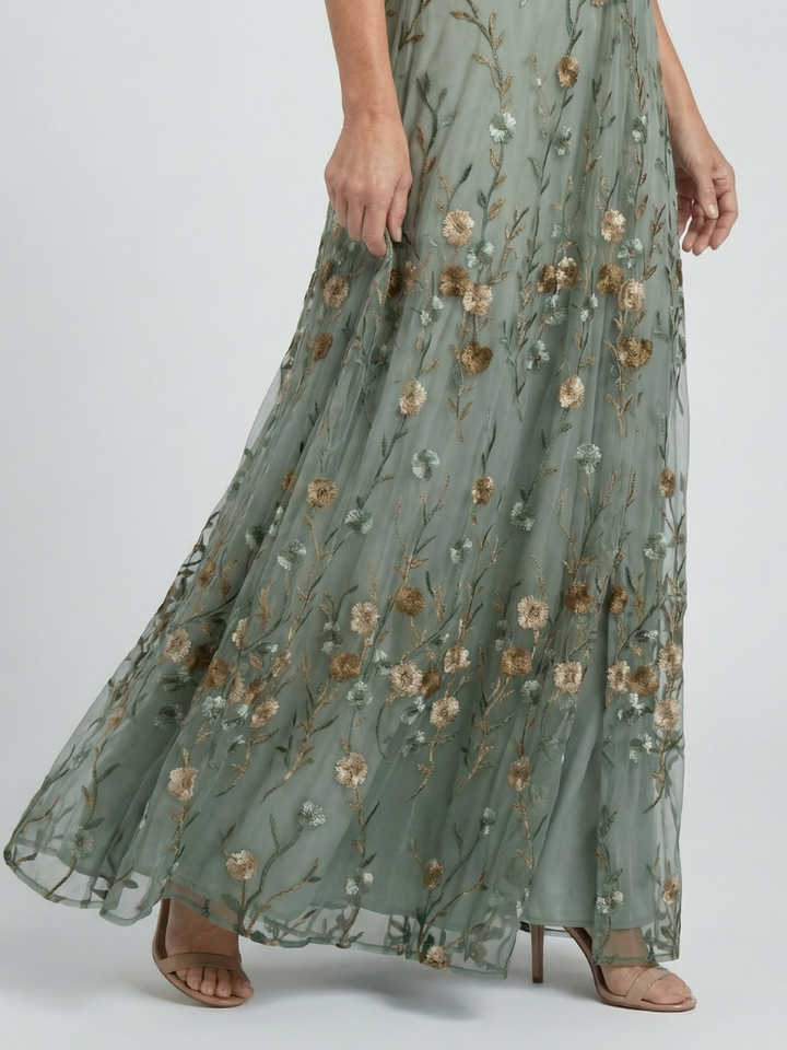 Sage green floral maxi dress with gathered tiered skirt and sheer look