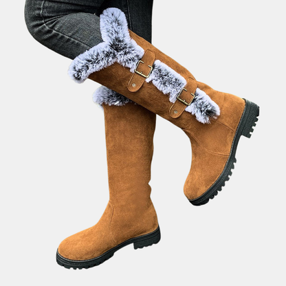 Light brown mid-calf boots with faux-fur ankle strap detail and black tread sole