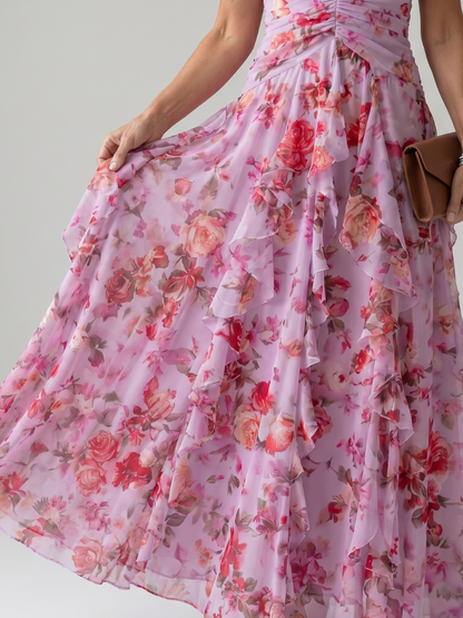 Floral maxi dress fabric close-up with ruched waist and layered chiffon ruffles